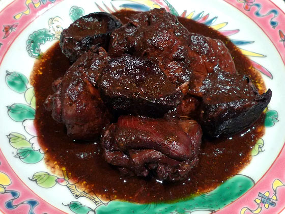 Peranakan food: Ayam Buah Keluak (chicken stewed with black nuts)