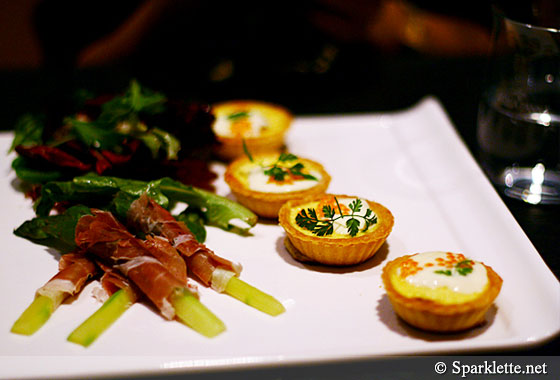 Smoked salmon tart with crème fraiche and ocean trout caviar, asparagus wrapped in basil and prosciutto