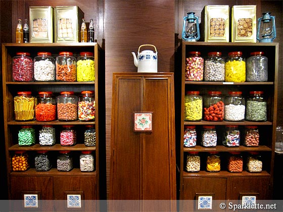 Wooden cabinets filled with sweets, candies and biscuits